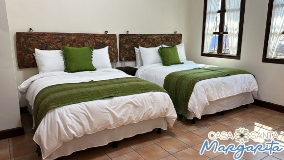 [Imagen:¡Valido para fiestas agostinas! ¡Paga $75 en Lugar de $148.69 por Estadía Familiar en Antigua Guatemala para 2 Adultos y 2 Niños (Hasta 9 años) en Habitación Doble, TV, Parqueo, Impuestos Incluidos y Más!]