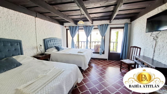 [Imagen:¡Inolvidable Estadía en Atitlán! ¡Paga Q350 en Lugar de Q650 por Estadía para 2 Personas en Habitación Doble + Uso de Piscina, Vista al Lago y Volcanes, Acceso a Playa Privada y Área Verde + Impuestos Incluidos!]