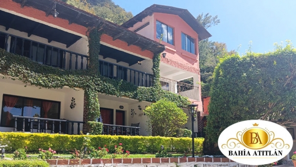 [Imagen:¡Inolvidable Estadía en Atitlán! ¡Paga Q350 en Lugar de Q650 por Estadía para 2 Personas en Habitación Doble + Uso de Piscina, Vista al Lago y Volcanes, Acceso a Playa Privada y Área Verde + Impuestos Incluidos!]