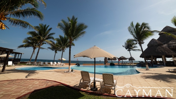 [Imagen:¡Playa, Relax y Confort en el Hotel Cayman Suites! ¡Paga Q737 en Lugar de Q1,046 por Estadía en Habitación Sencilla o Doble Para 2 Adultos y Hasta 2 Niños + Uso Ilimitado de Atractivas Instalaciones + Impuestos Incluidos!]