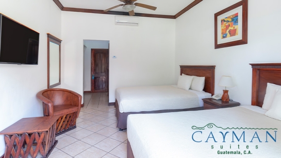 [Imagen:¡Playa, Relax y Confort en el Hotel Cayman Suites! ¡Paga Q737 en Lugar de Q1,046 por Estadía en Habitación Sencilla o Doble Para 2 Adultos y Hasta 2 Niños + Uso Ilimitado de Atractivas Instalaciones + Impuestos Incluidos!]